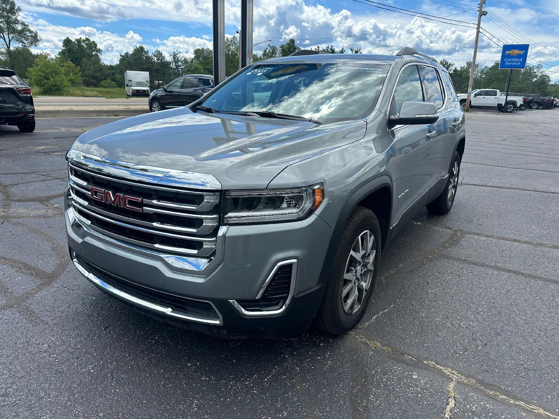 2023 GMC Acadia SLE in Sterling Metallic — front three-quarter view