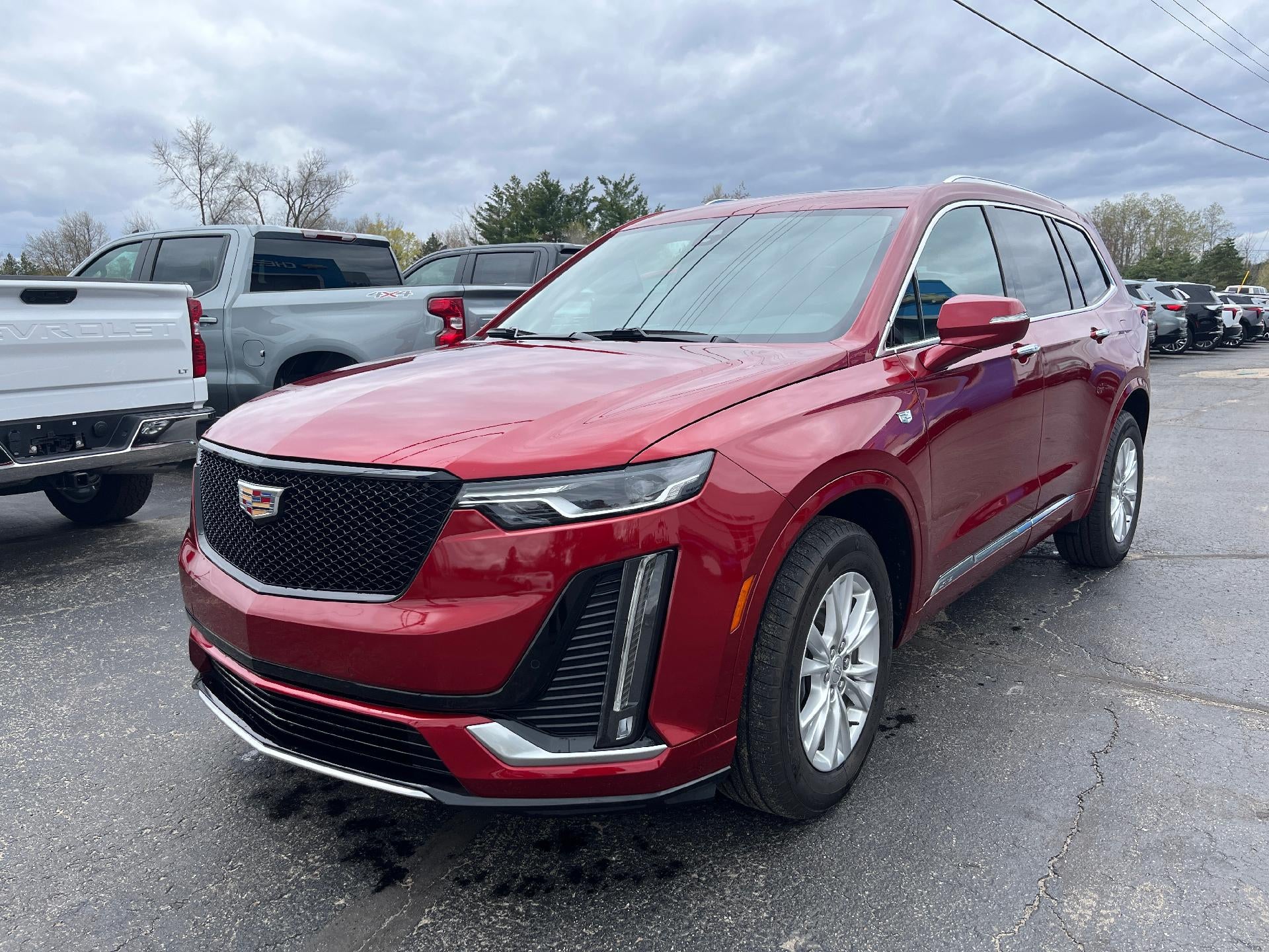 2024 Cadillac XT6 Luxury in Radiant Red Tintcoat — front three-quarter view