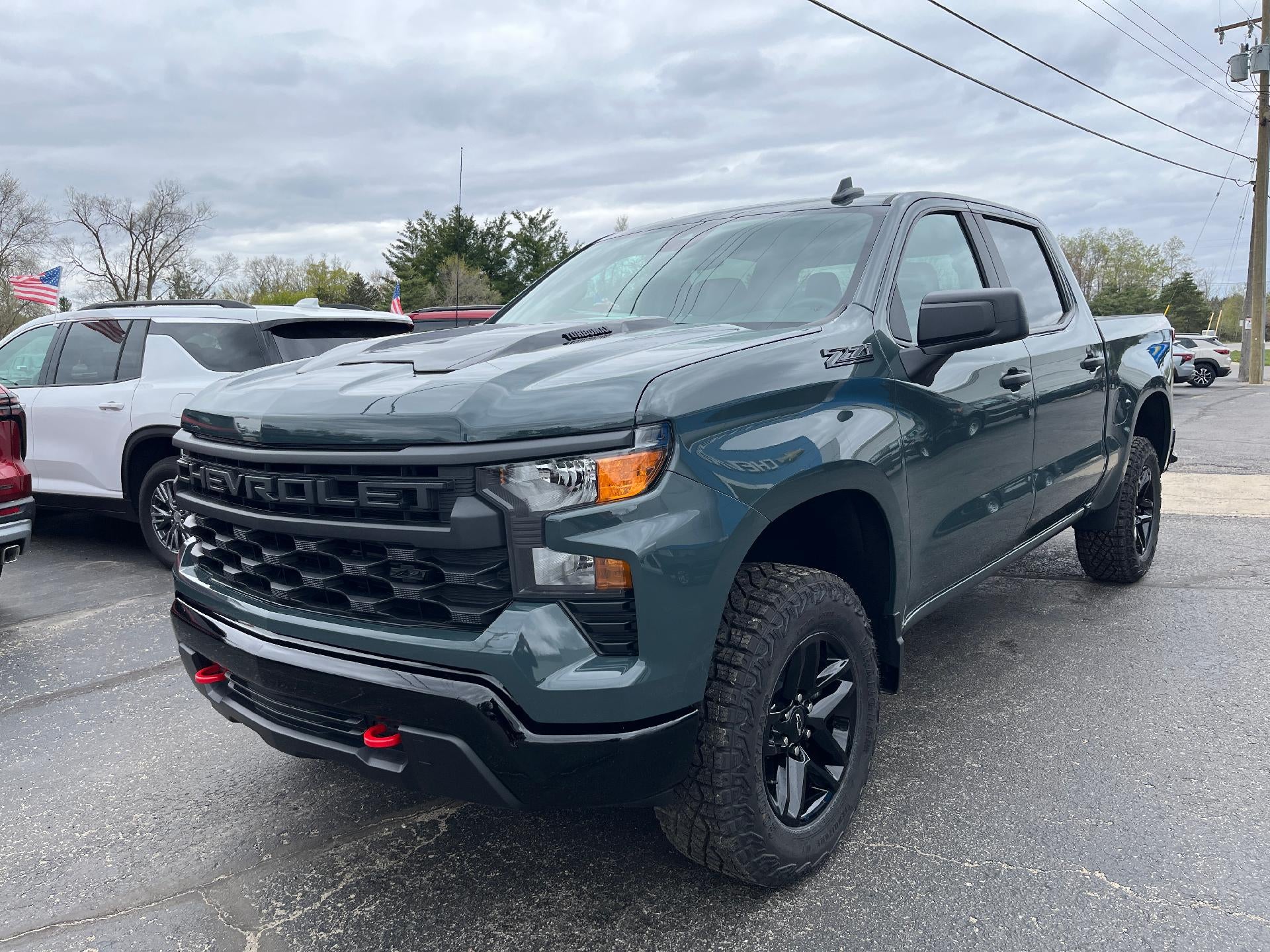 2025 Chevrolet Silverado 1500 Custom Trail Boss in Cypress Gray — front three-quarter view