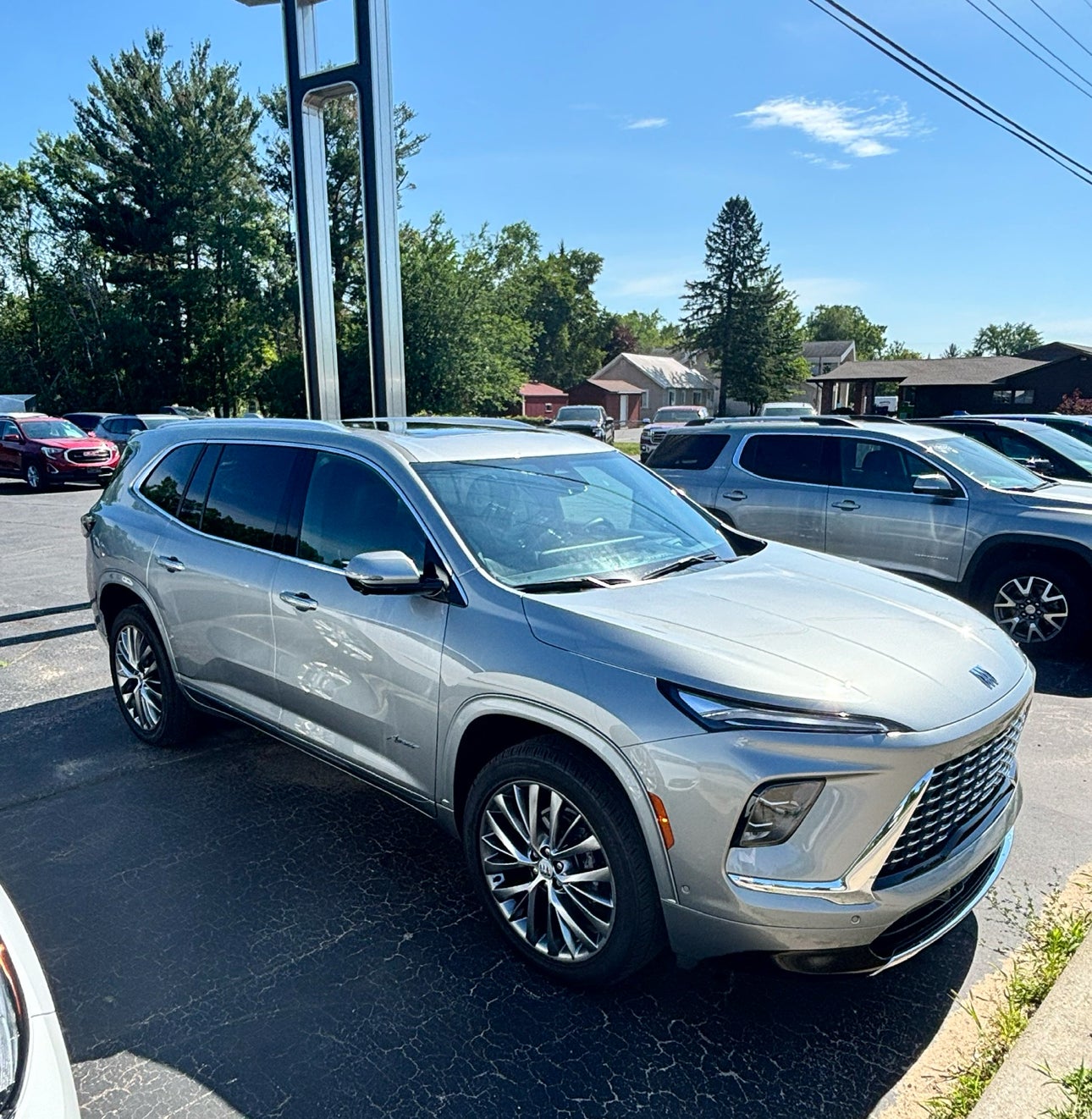 2025 Buick Enclave Avenir in Moonstone Gray Metallic — front three-quarter view